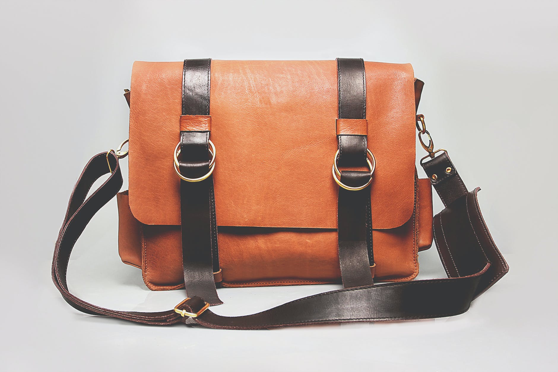 orange and black leather satchel bag